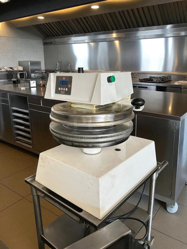 Proluxe DP2010M 22" pizza dough press, amazing condition, countertop model with mold inserts, fully tested, kitchen setting.