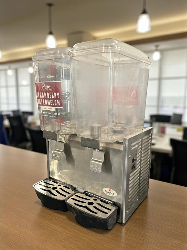 Crathco D25-3 dual bowl cold beverage dispenser in excellent condition. Features 115V power, tested and working perfectly.