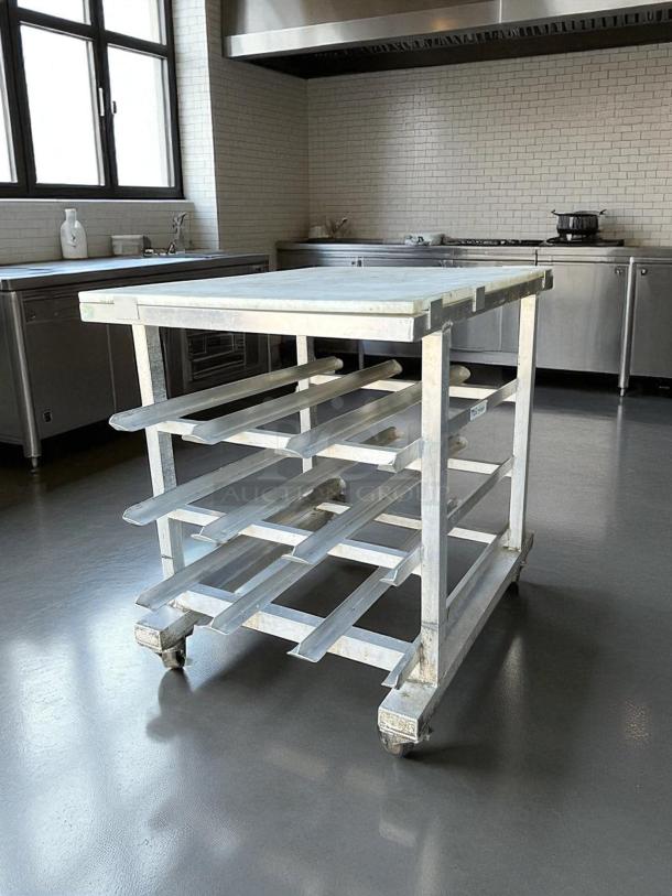 New Age mobile aluminum can rack with poly top cutting board, excellent condition, half size, holds #10 and #5 cans.