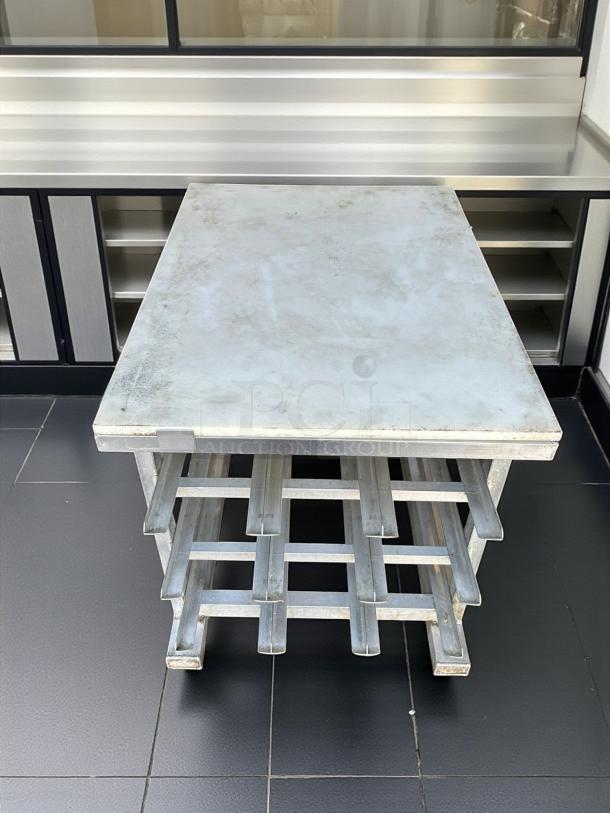 NEW AGE mobile aluminum can rack for #10 and #5 cans, with a PolyTop cutting board. Excellent condition.