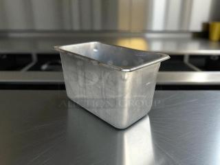 1/4 size 6” deep stainless steel hotel pan in excellent condition, showing minimal wear; ideal for catering use.