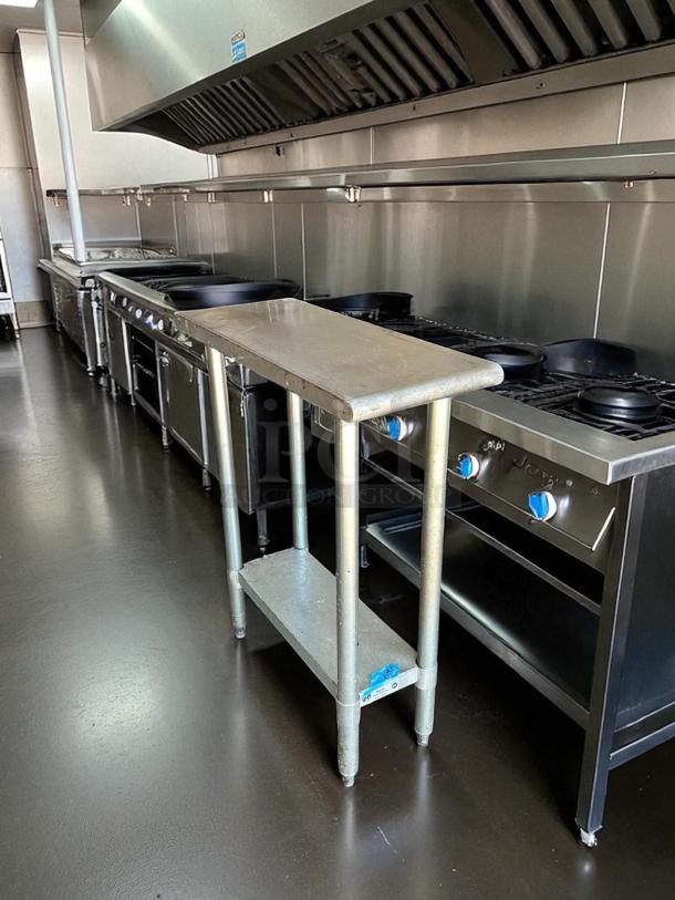 GSW stainless steel worktable in excellent condition with a lower shelf, ideal for kitchen use.