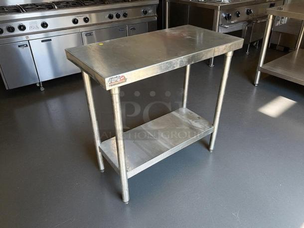 GSW all stainless steel worktable, great condition, with shelf and sturdy legs; "GSW" label indicates quality craftsmanship.
