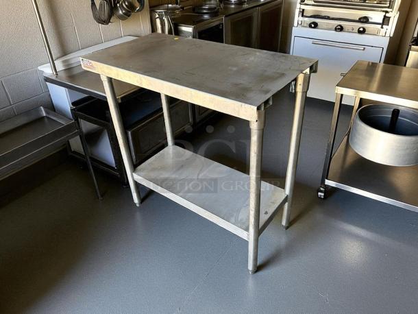 GSW stainless steel worktable in great condition, features sturdy design and lower shelf. Ideal for kitchen use.
