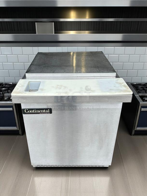 Continental Refrigerator SW27-SS prep table, 27", stainless steel, great condition, visible brand label, tested & working.