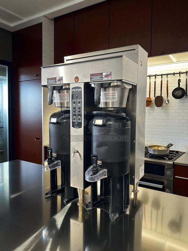 Fetco CBS-2052e dual station coffee brewer in excellent condition; tested and working, 208-240V, stainless steel.
