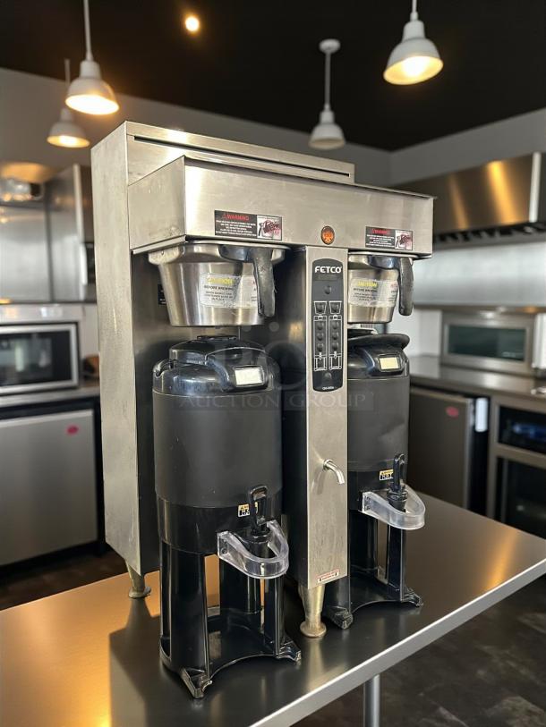 Fetco CBS-2052e dual station coffee brewer, excellent condition, 208-240V, fully tested, stainless steel, two dispensers.