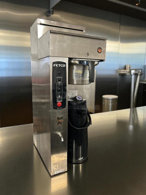 Fetco CBS-2051e E51016b Coffee Brewer, stainless steel, 1.5 gal, excellent condition, visible caution label.