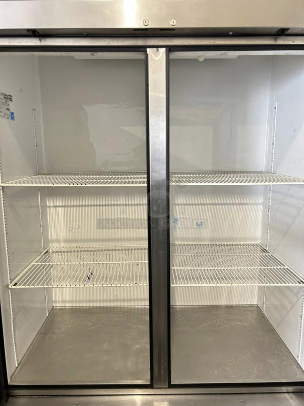 True T-49 54" two-section reach-in refrigerator, great condition, tested and working, 115V, spacious shelves, stainless steel.