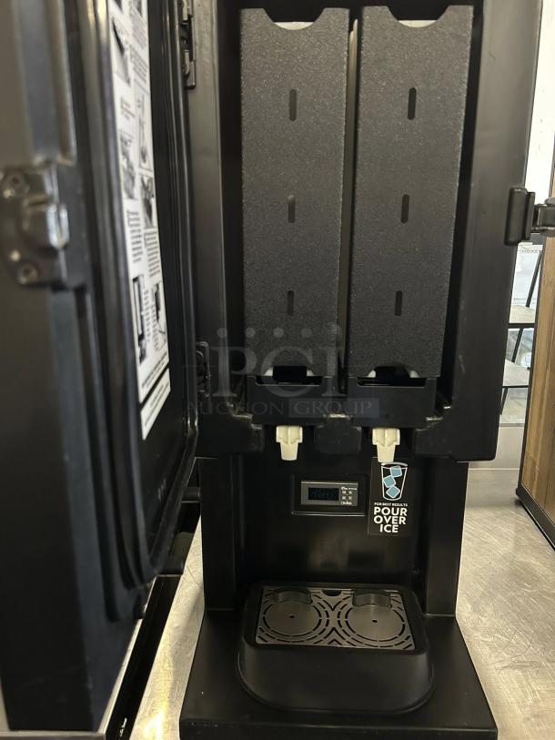 CreaMiser 230 STōK Cold Brew Dispenser, 110V, fully tested, dual spouts, with labels; black, in working condition.