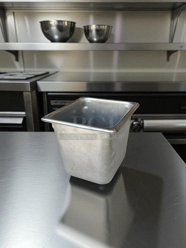 1/6 size, 6-inch deep stainless steel hotel pan, suitable for prep tables, shown in excellent condition.