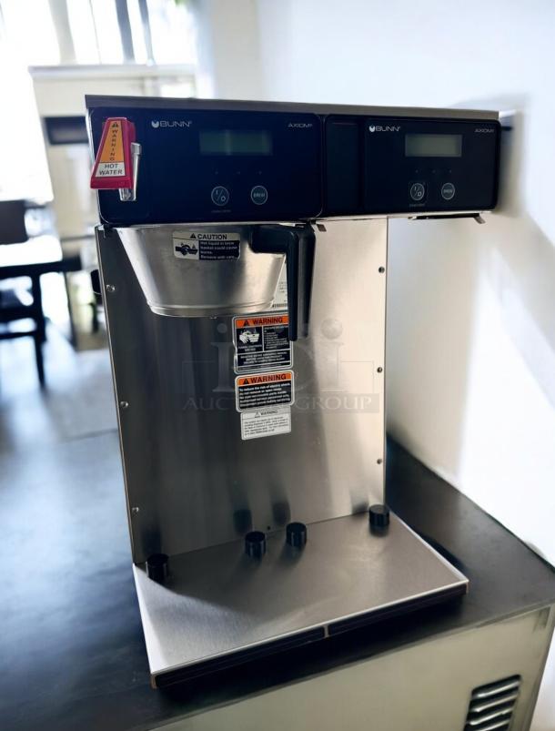 Bunn Axiom Twin APS Automatic Coffee Brewer in excellent condition, stainless steel finish, 120/208–240V, tested and working.