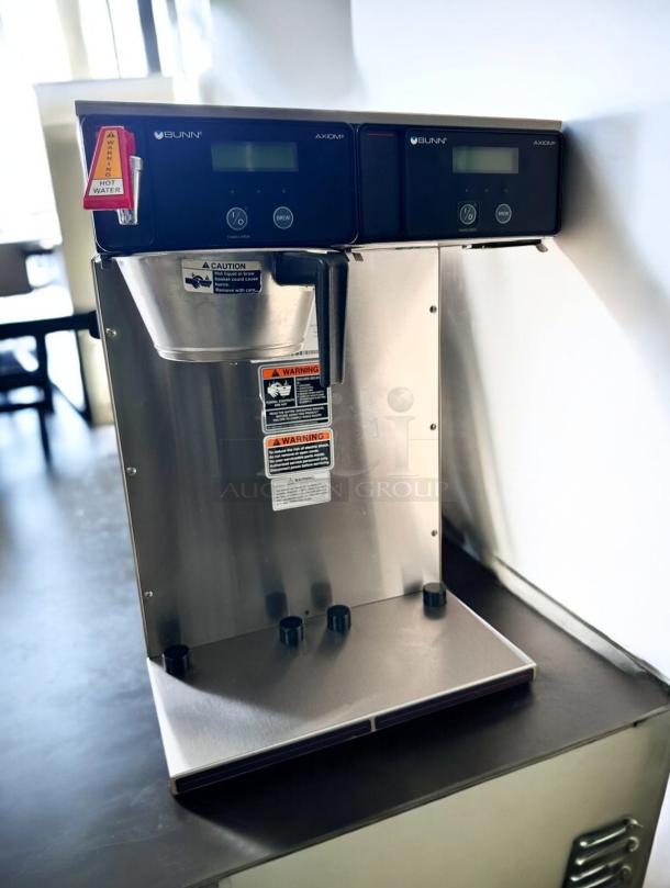 Bunn Axiom Twin APS Automatic Coffee Brewer, excellent condition, 120/208–240V, tested and working, caution and warning labels visible.