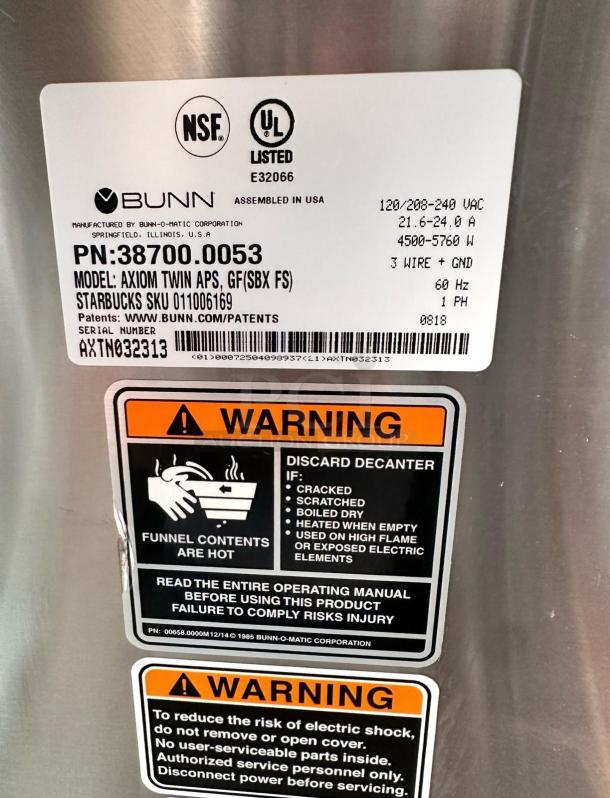 Bunn Axiom Twin APS Coffee Brewer in excellent condition, 120/208-240V, tested and working, with warning labels visible.