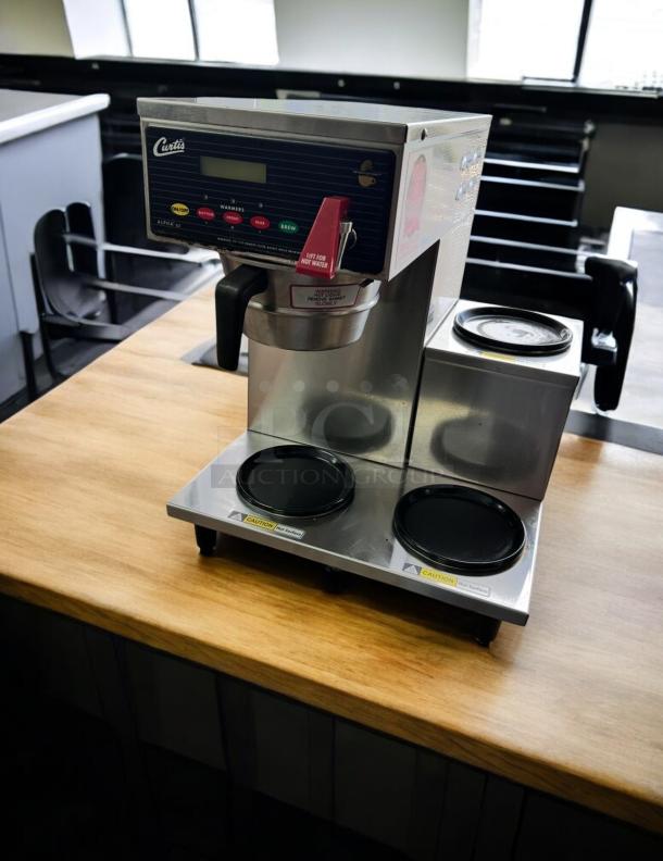 Curtis ALP3GTR12A000 coffee brewer, stainless steel, automatic, 3 warmers, 120V, tested, excellent condition.