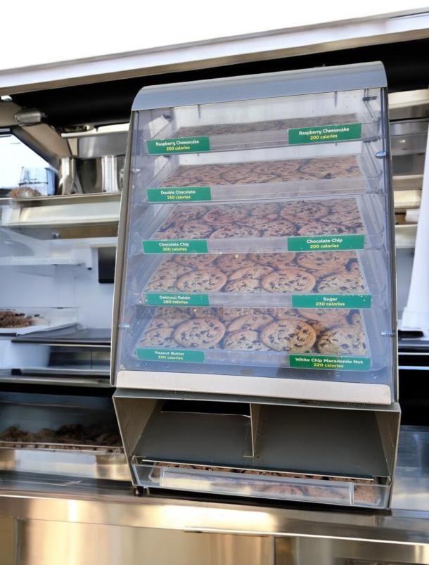 Nemco 6490-SUBA Cookie Display Case, great condition, 24"H x 17"W x 12"D. Features labeled trays. Tested & working.