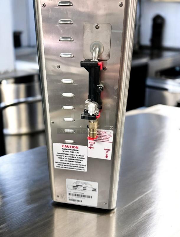 Newco FPM-1 Lemonade Dispenser, excellent condition, stainless steel, tested working, caution labels visible, sealed unit.