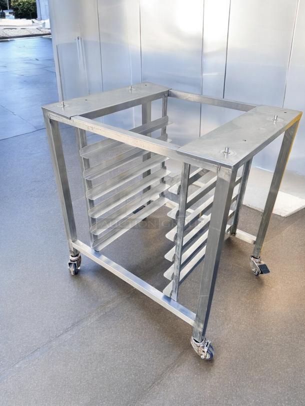 Stainless steel mobile pan rack, excellent condition, on casters. Tested and working, ideal for kitchen use.