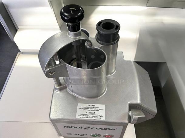 Robot Coupe CL50 food processor, 1.5 hp, with 3 discs, perfect condition, tested and working, caution label visible.
