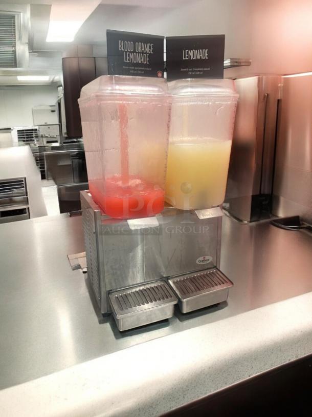 Crathco D25-3 dual tank cold beverage dispenser, excellent condition, 115V, fully tested, two labeled containers for drinks.