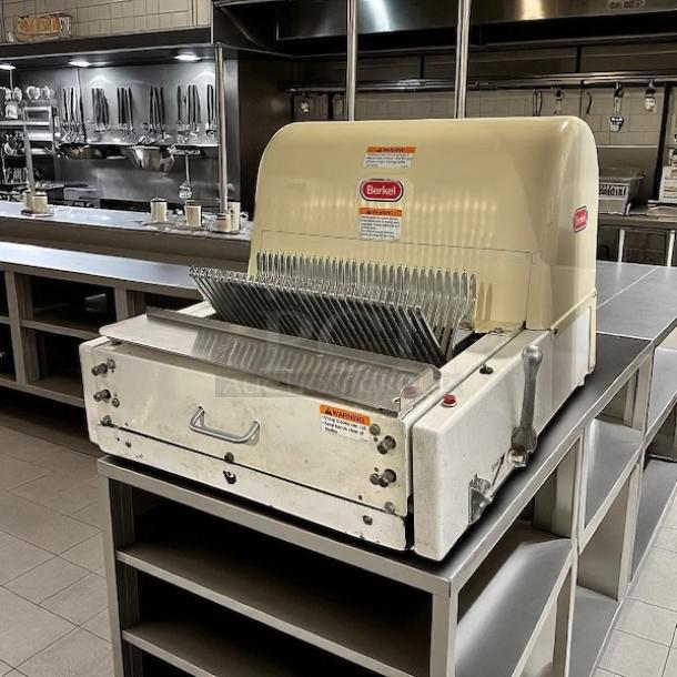 Berkel MB 1/2 bread slicer in excellent condition, 115V, fully tested and working, visible brand logo and safety labels.