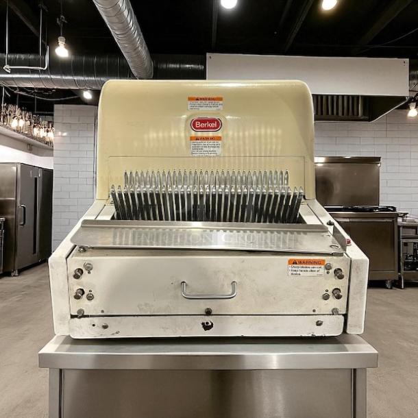 Berkel MB 1/2 bread slicer in excellent condition, 115V, fully tested and working, features visible safety warnings.