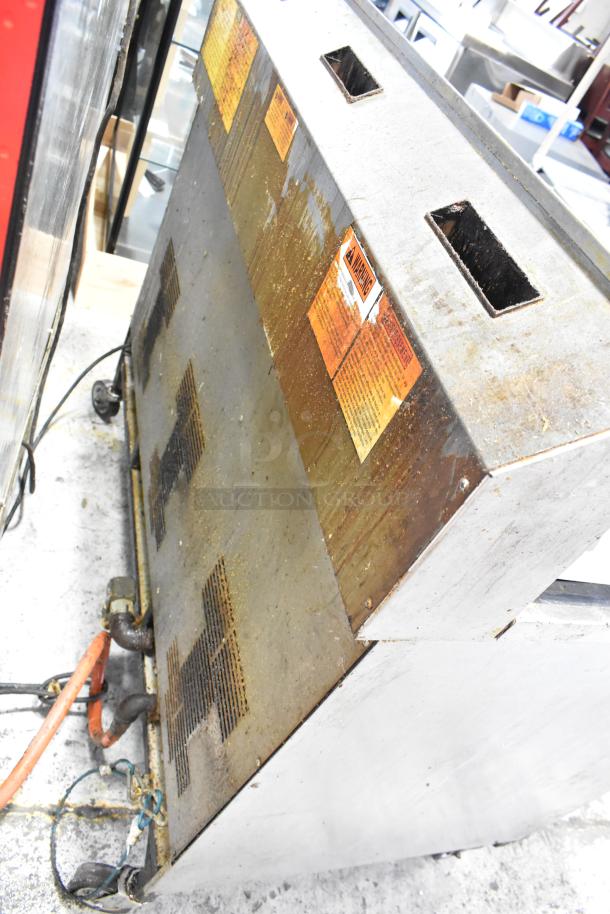 Henny Penny EEG-243 FFFX ST stainless steel natural gas deep fryer, 3 bay, filtration system, on casters, 225,000 BTU.