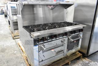 Brand new Venancio R602CO-60B stainless steel 10-burner range with 2 convection ovens, over shelf, and backsplash.