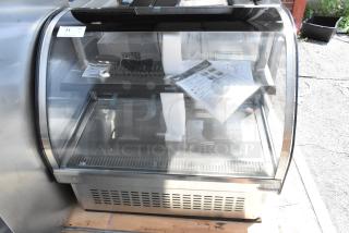 Brand new Vollrath RDE7136 stainless steel refrigerated display case with curved glass. Commercial use, 120V, 1 phase.