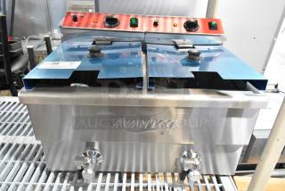 Brand new Avantco 177F202 stainless steel dual tank electric fryer, 30 lb. capacity, with 2 baskets and lids. 208-240V.
