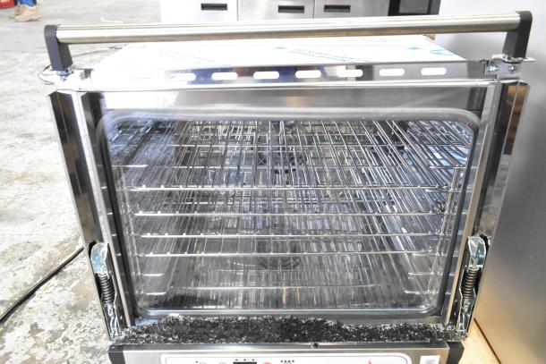 BRAND NEW SCRATCH AND DENT Cooking Performance Group 351COHD4M countertop convection oven, showing damaged and broken glass.