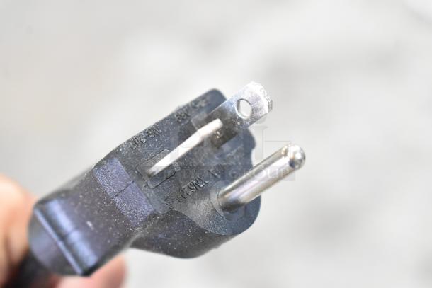 Close-up of a black power plug labeled for 208-240 volts, 1 phase, part of the Cooking Performance Group CPG 351COHD4M oven.