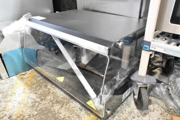 Brand new Avantco 177OAM1A 26" black metal countertop merchandiser with LED lighting, 1 shelf, minor scratches.