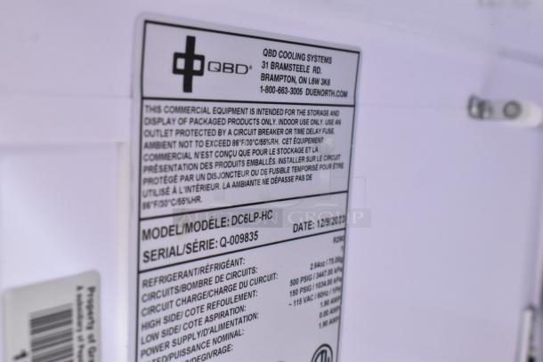 Label of 2023 QBD DC6LP-HC Mini Cooler Merchandiser, model and serial details, 115V, 1 phase, poly coated racks.