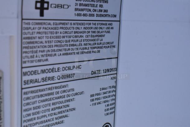 Label of QBD DC6LP-HC Commercial Mini Cooler with model, serial number, and specifications for electrical and refrigerant details.