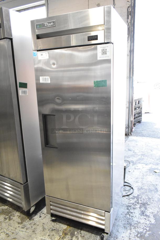 2022 True T-19F-HC stainless steel single door commercial freezer with poly coated racks and commercial casters.