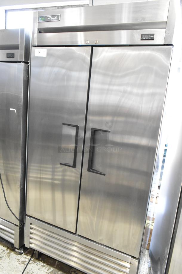 2020 True T-35-HC stainless steel 2-door reach-in cooler with poly-coated racks, commercial casters, 115V, 1 phase.