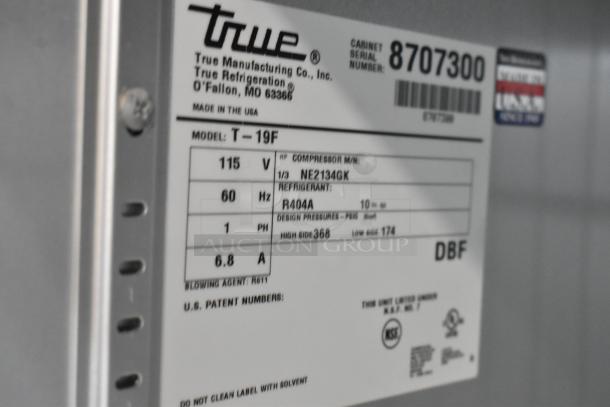 True T-19F stainless steel commercial freezer label, 115V, 1 phase, model number and specifications visible.