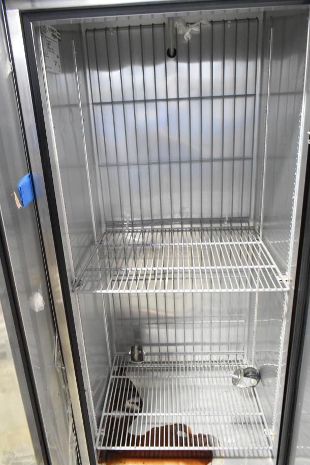 2016 True T-19F stainless steel commercial reach-in freezer, single door, includes poly-coated racks and commercial casters.