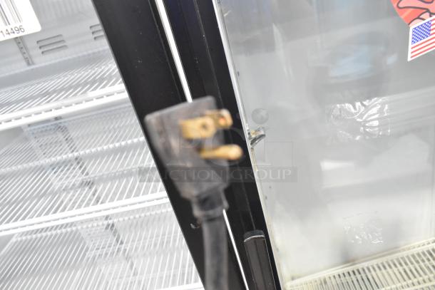 True GDM-10 single door cooler with poly-coated racks, visible plug, 115 volts, 1 phase. Ideal for commercial use.