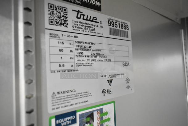 2020 True T-35-HC stainless steel 2-door commercial cooler with poly coated racks, 115V, 1 phase, serial 9951868 label.
