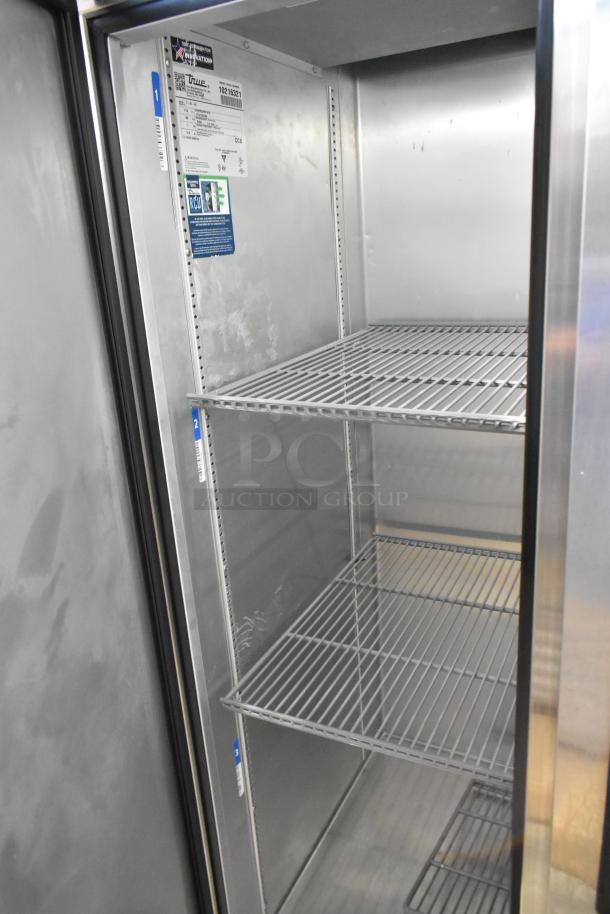 2022 True T-35-HC 2 Door Reach-In Cooler with poly coated racks, stainless steel, excellent condition, 115V, 1 phase.