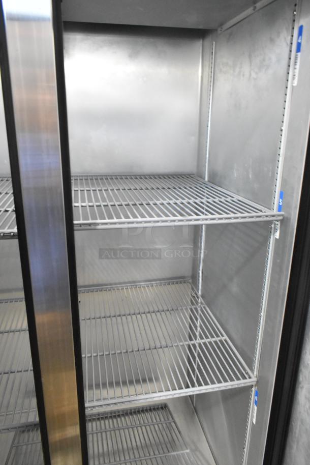 2022 True T-35-HC stainless steel 2-door reach-in cooler, poly-coated racks, 115V, 1-phase, excellent condition.