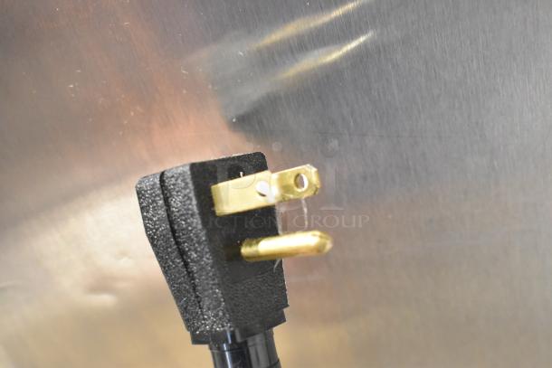 Close-up of the power plug of a 2022 True T-35-HC Stainless Steel Commercial 2 Door Reach In Cooler.