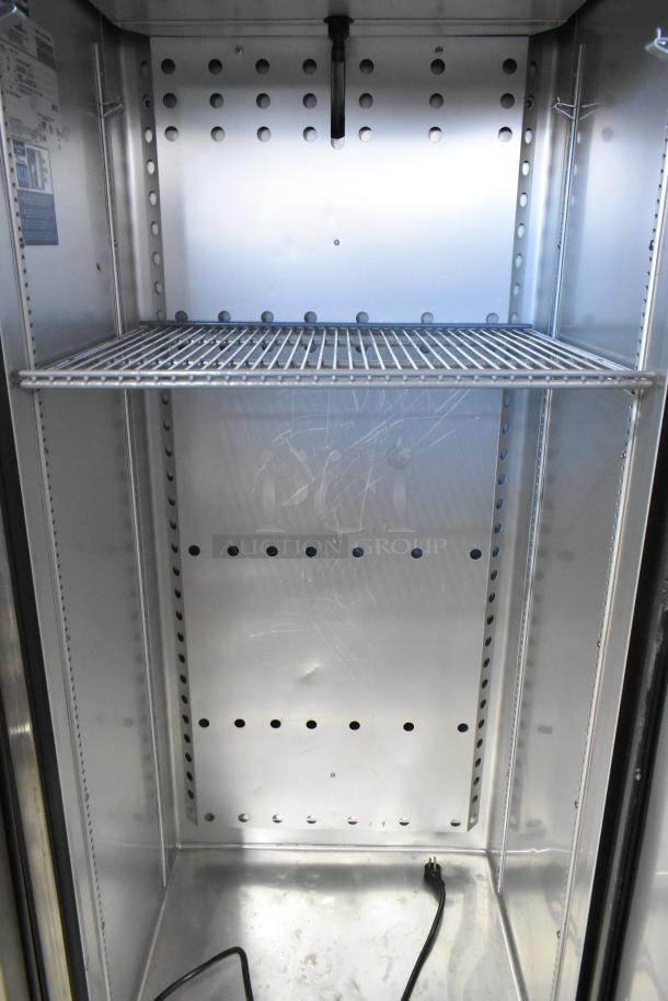 2022 True T-19F-HC stainless steel freezer, features poly-coated racks, single door, 115V, 1 phase, clean interior.