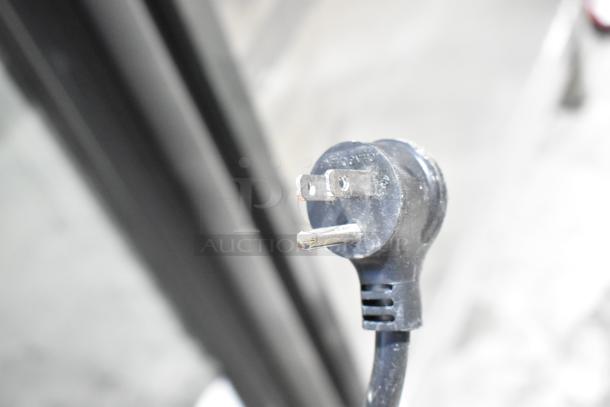 Close-up of a 115-volt power cord plug for the 2022 True T-19F-HC commercial reach-in freezer.