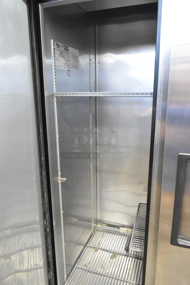 2016 True T-35 stainless steel commercial cooler, 2 doors, poly-coated racks, 115V, 1 phase, interior view with label.