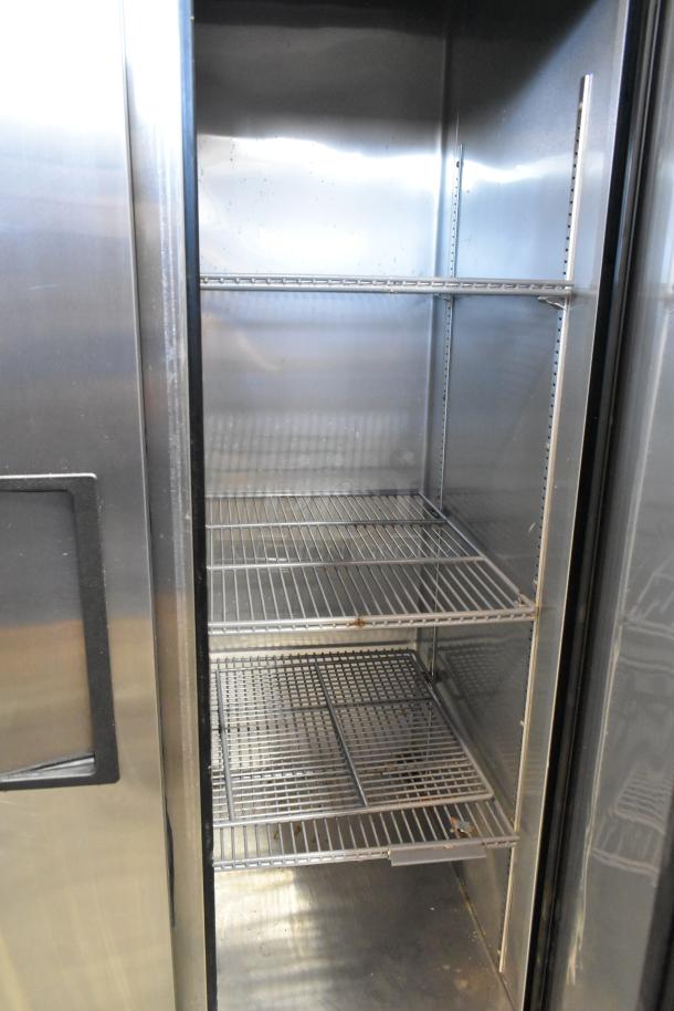 2016 True T-35 stainless steel 2-door reach-in cooler with poly-coated racks, 115 volts, 1 phase, clean interior.