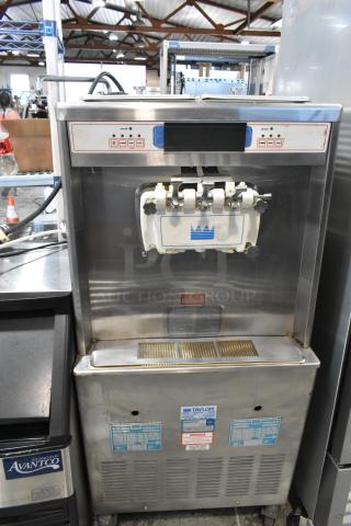 Taylor 754-33 Stainless Steel Commercial Floor Style 2 Flavor w/ Twist Soft Serve Ice Cream Machine on Commercial Casters. 208/230 Volts, 3 Phase. - Item #1203640
