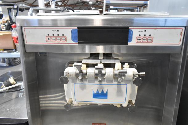 Taylor 754-33 stainless steel 2-flavor soft serve machine with twist, commercial casters, 208/230V, 3 phase.